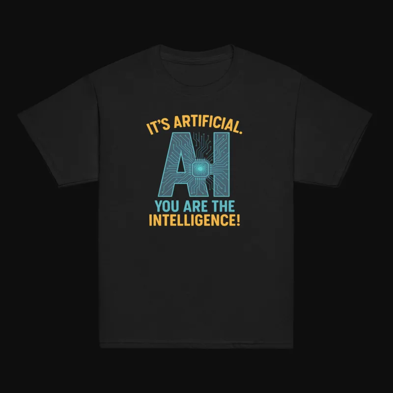Black youth tee printed with “It's artificial. AI. You are the intelligence!”